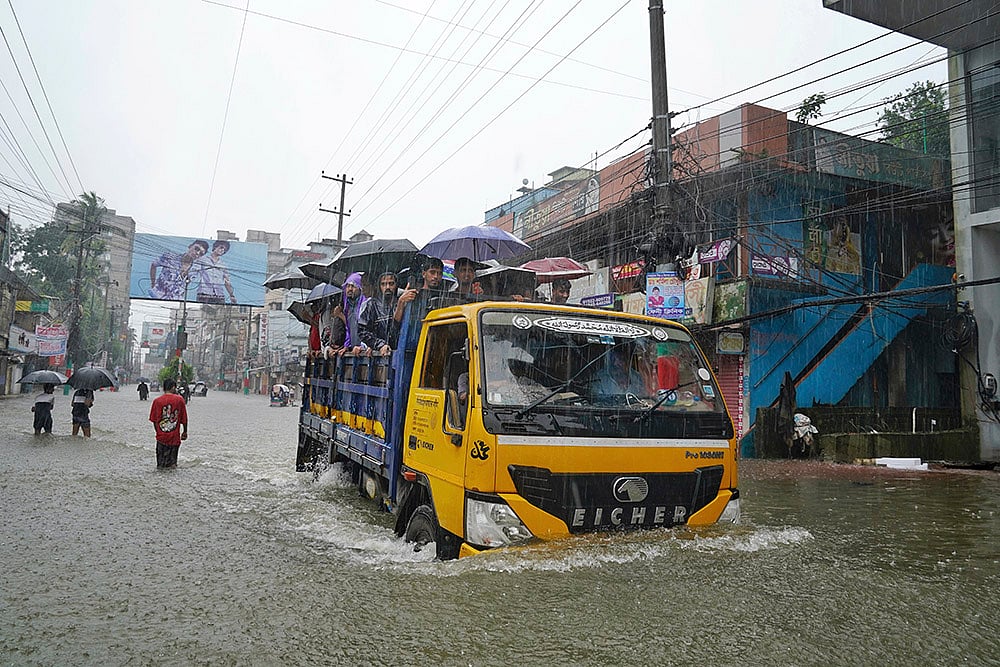 | Photo: PTI : Bangladesh Floods: Flooded street after rains in Feni district 